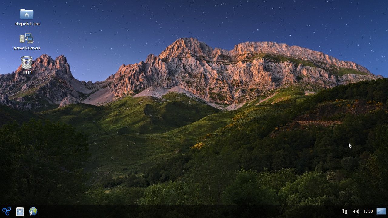 trisquel homescreen screenshot with a wallpaper displaying green mountain and a space sky