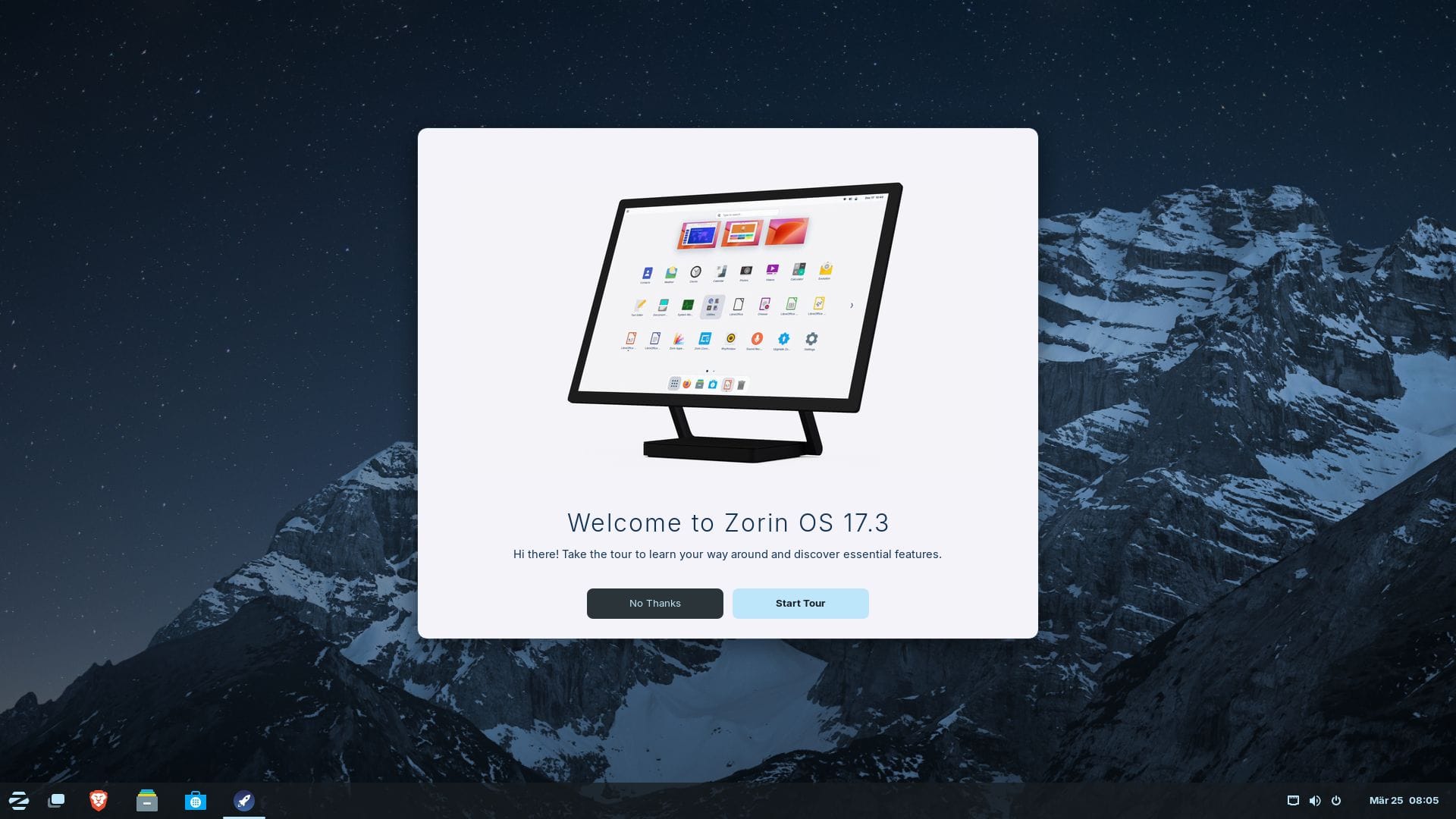 zorin os 17.3 welcome app open with a mountain wallpaper in the background and a taskbar (called panel) at the bottom