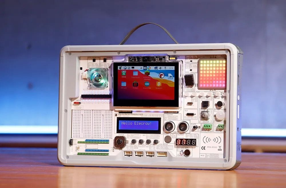 the crowpi 3 sitting on desk with its two lcd displays and rgb matrix on with a linux-based operating system running on it