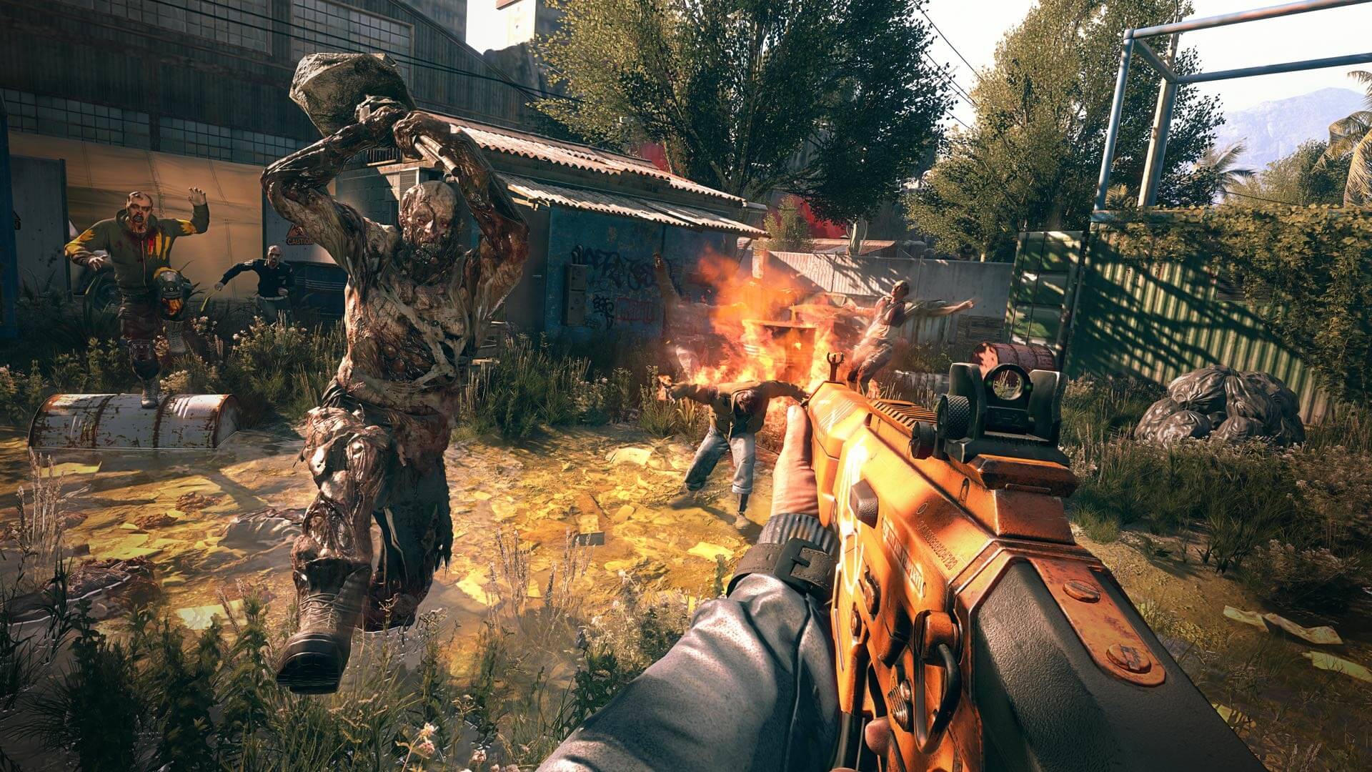 in a overgrown lot, four zombies are rushing the player, who has an assault rifle in his hands