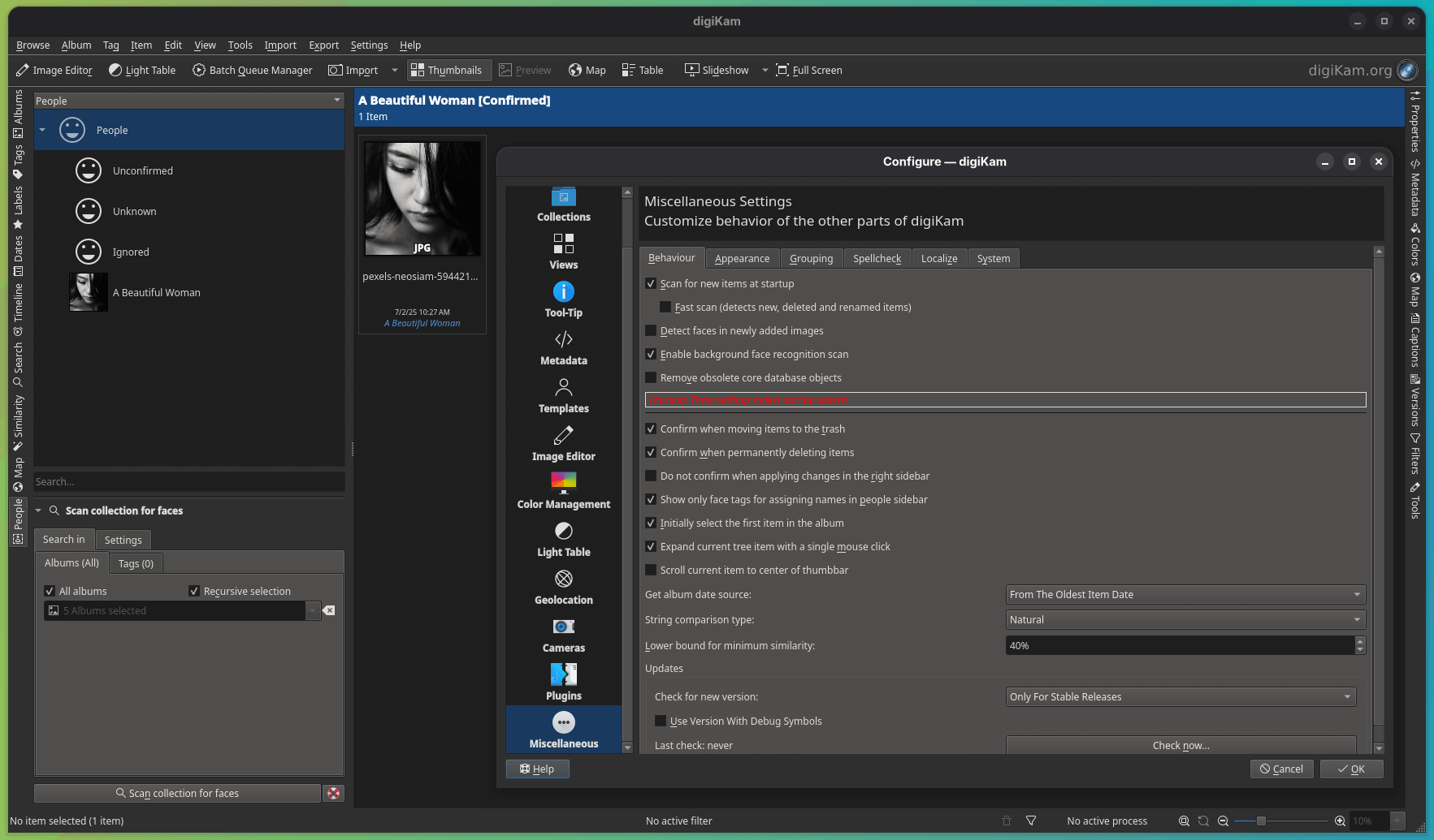 digikam 8.7 with the people tab open in the background, showing the face of a woman, who is tagged as "a beautiful woman", the dialog above it, is the behaviour sub page of the miscellaneous settings page