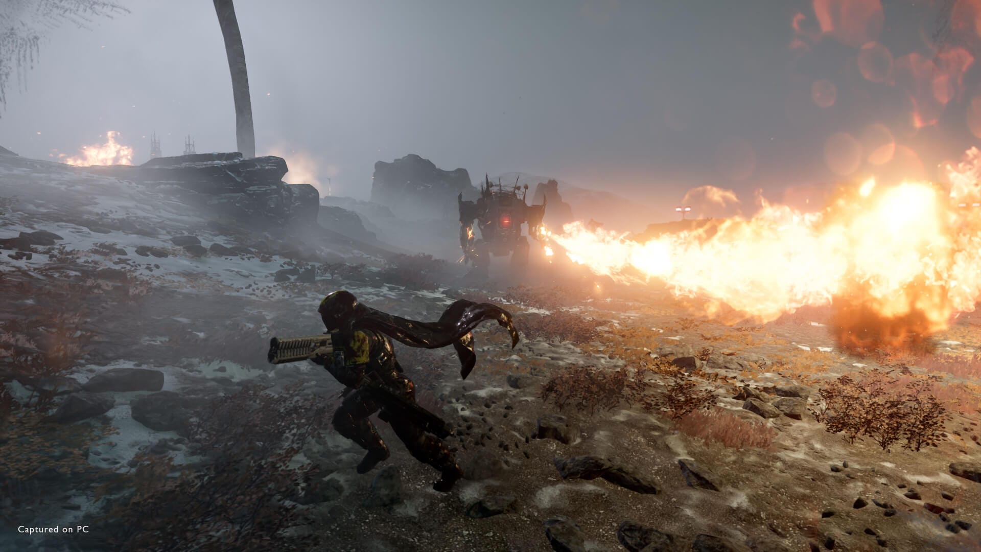 a automaton jet brigade hulk is seen throwing flames at an armed player, who is dodging to the left