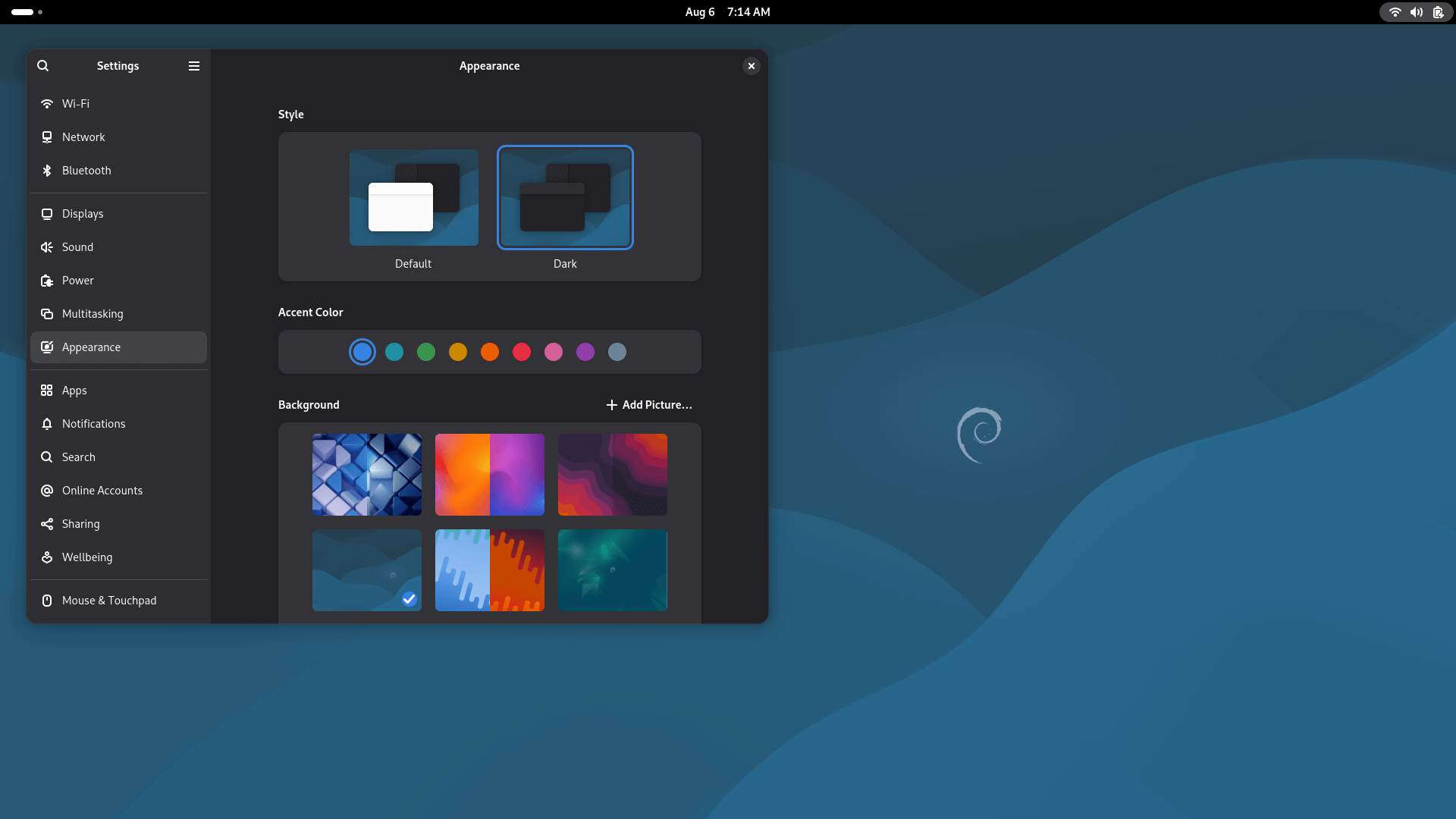 the appearance page in the settings app is shown on the left with many wallpapers in it, the new wallpaper is in the background, with a wavy look to it, with a blue shade and the debian logo offcenter towards the right
