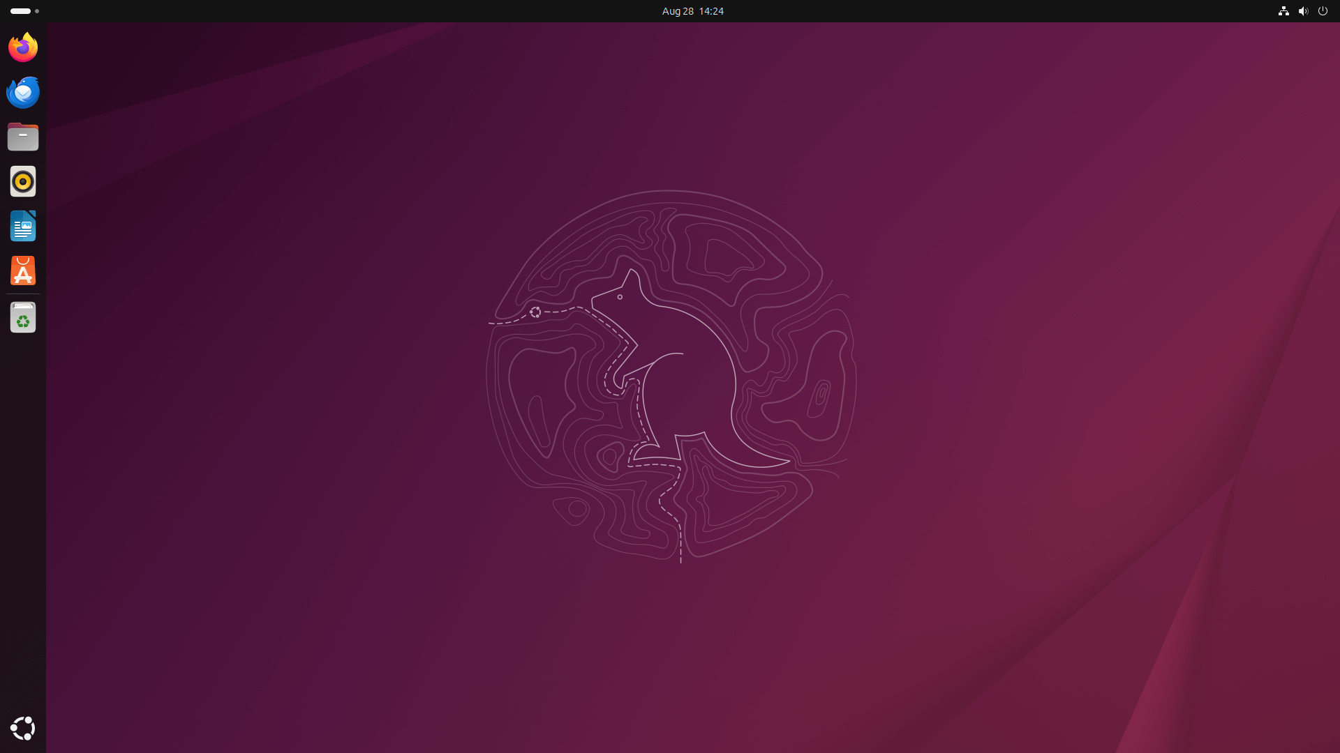 the desktop view of ubuntu 25.10 is shown with the new quokka-themed topographical wallpaper