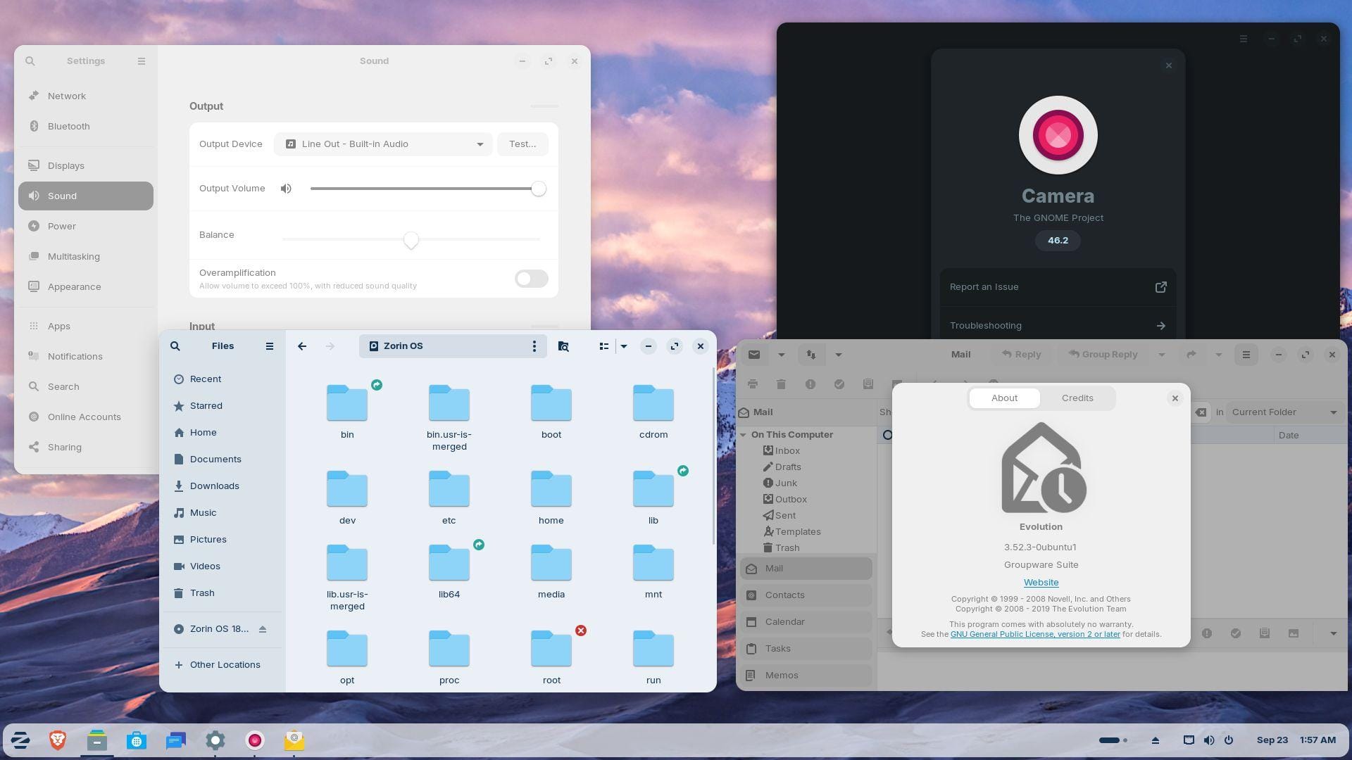 the refined interface and core apps in zorin os 18 beta are shown here, arranged neatly on the desktop, on the left is the settings and files app, on the right is the camera and evolution app