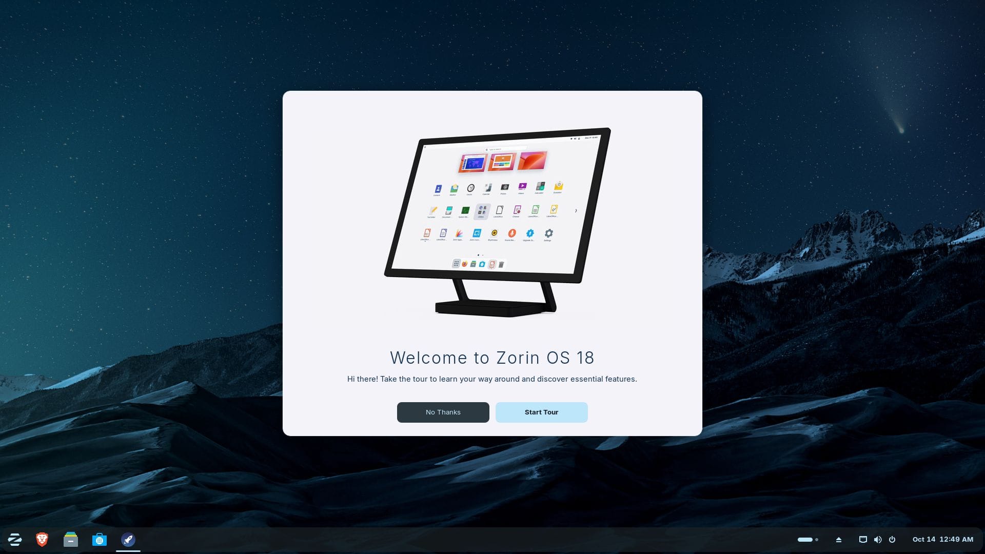 the welcome tour app is open on zorin os 18, with the dark mode for the interface visible all around, and the wallpaper being one of a icy mountain landscape with the stars visible in the sky