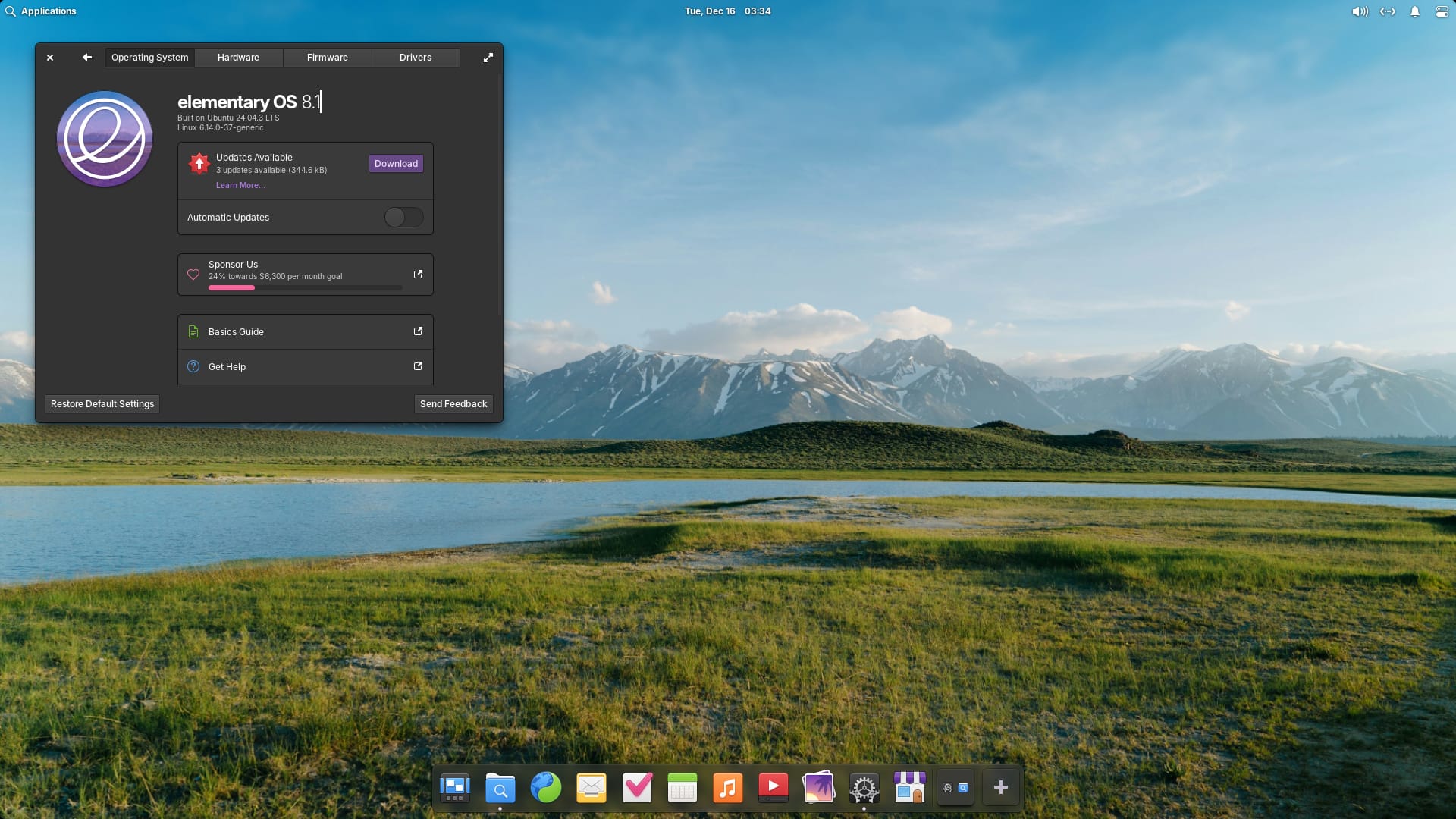 the desktop view of elementary os 8.1 is shown here with the system dialog open on the left, and a wallpaper showing greenery and a mountain range in the background are seen behind it
