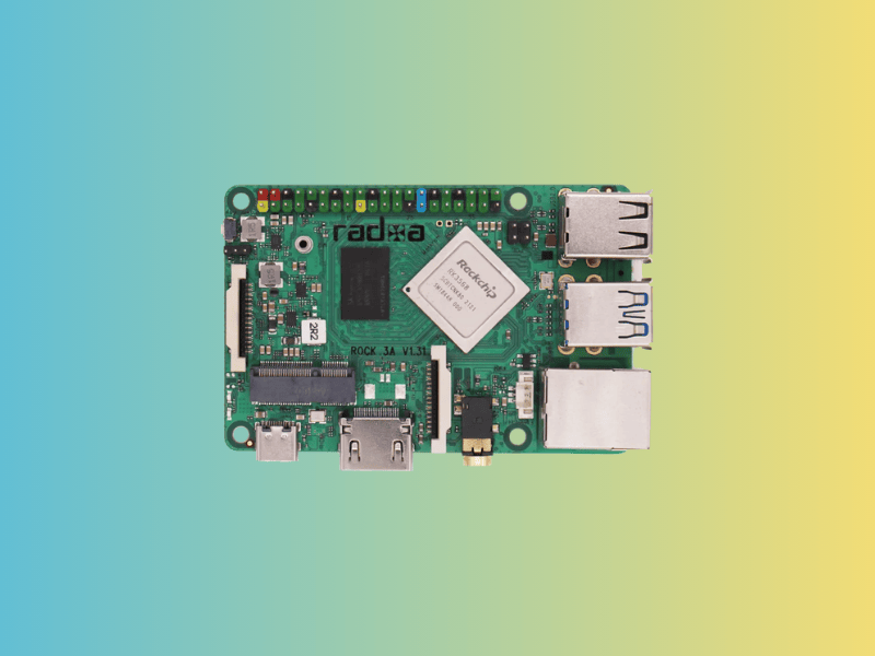 this mixed green background picture shows a radxa rock 3a device in the center