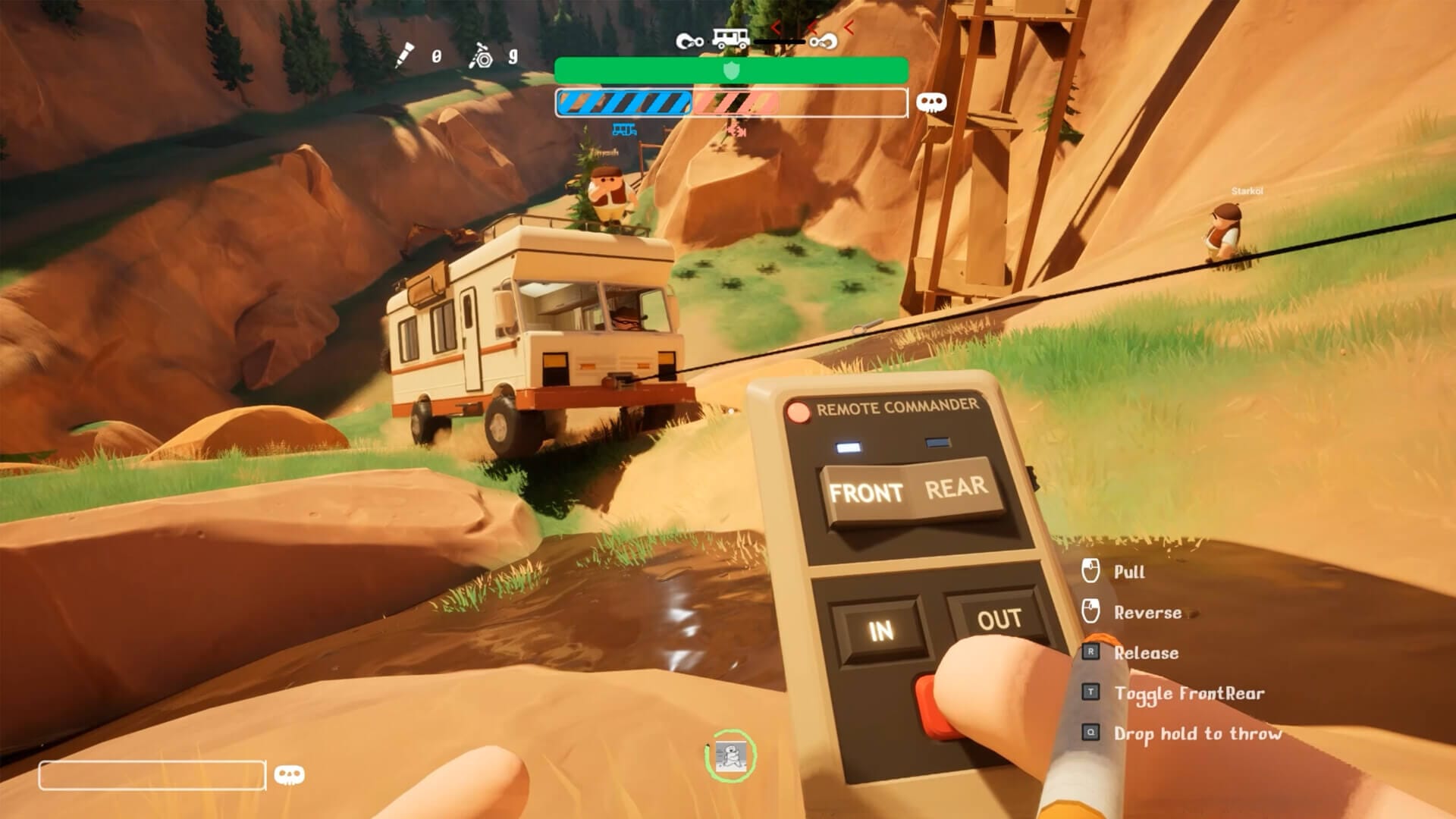 the player is seen controlling a winch remotely to pull a rv truck across a stretch of water