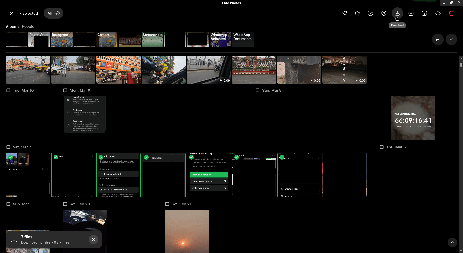 screenshot of the ente photos linux client showing the file downloading feature, with the button for it on the top-right, and a downloads progress interface element on the bottom-left
