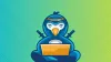 A penguin dressed up as Ninja and using a laptop