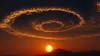 Sky at sunset that also shows clouds in spiral formation that resmbles Debian logo